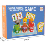 Box of a small animal transposition game with toy animals and cards on a blue background