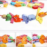 Colorful animal-shaped puzzle with a string, held by a hand.