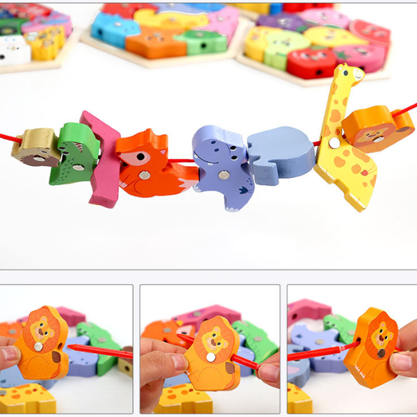 Colorful animal-shaped puzzle with a string, held by a hand.