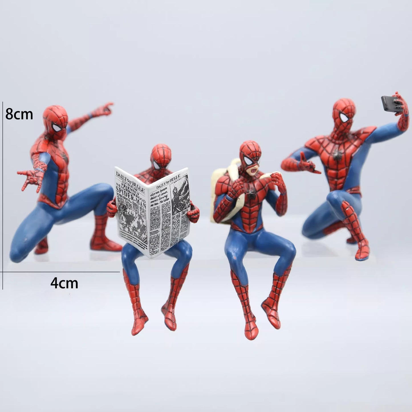 Four Spider-Man action figures in different poses on a light gray background