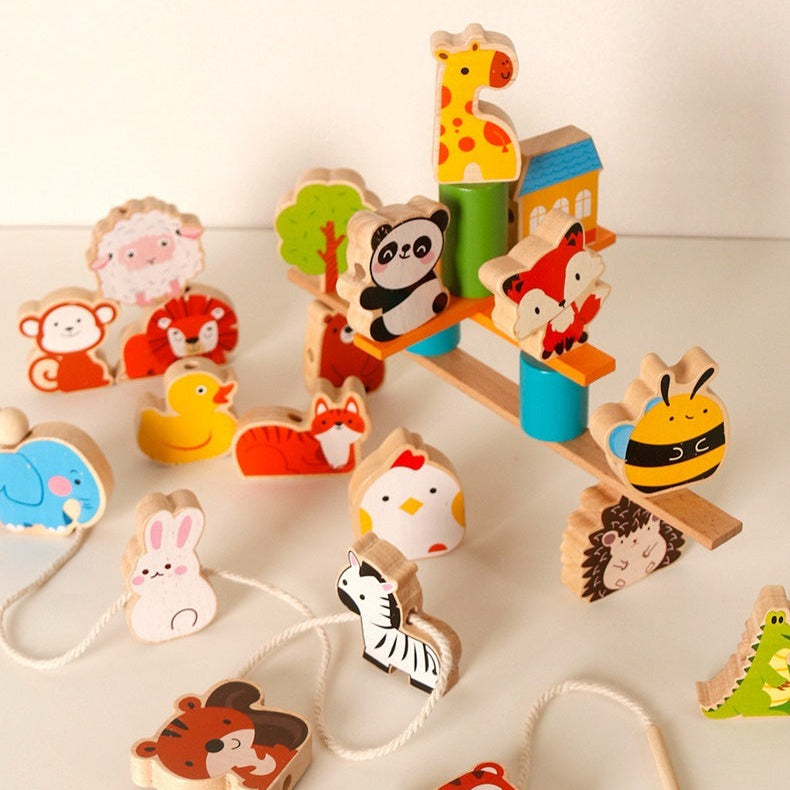 Set of colorful wooden animal figures on a white background