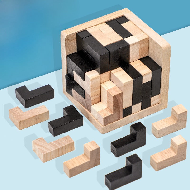 Wooden puzzle with black and beige pieces on a light blue background
