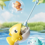 Yellow toy fish with a fishing rod in a water setting with bubbles and grass in the background