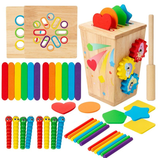 Collection of colorful wooden educational toys including a box with gears, rainbow sticks, and various shapes.