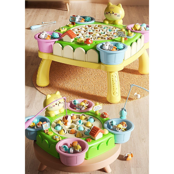 Colorful children's fishing toy table with various compartments on a wooden floor.