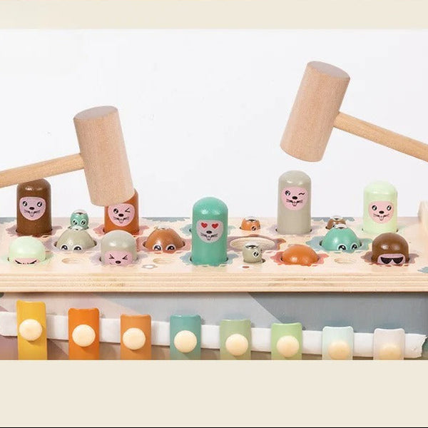 Children's toy set with a xylophone and figurines on a light background