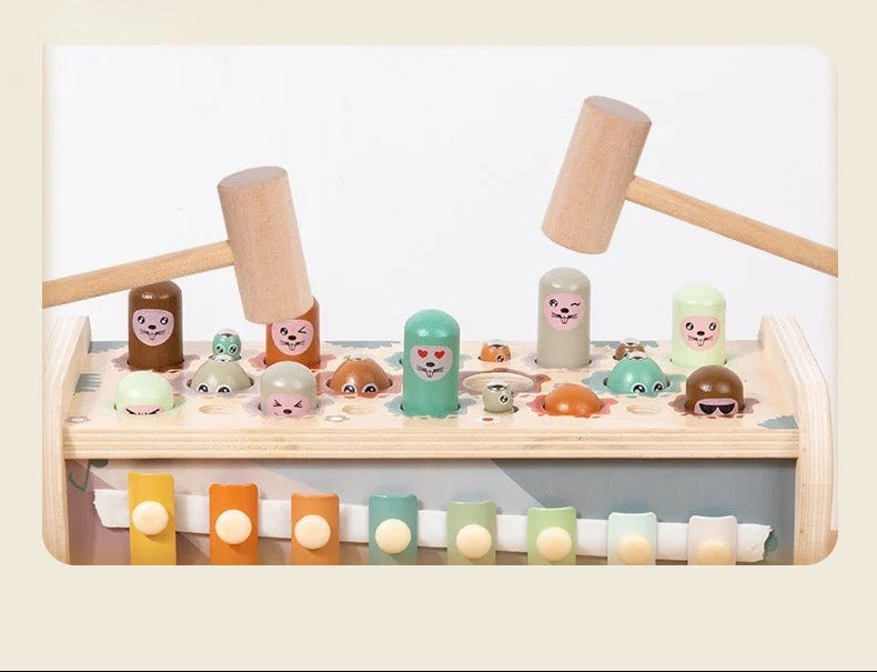 Children's toy set with a xylophone and figurines on a light background