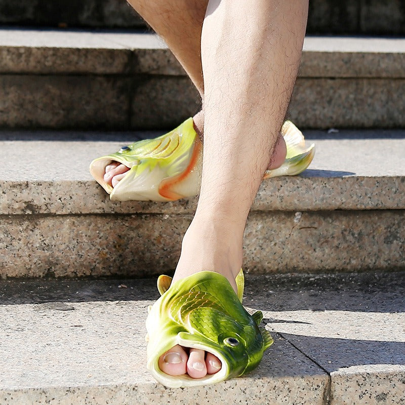 Person wearing fish-shaped sandals on a stone staircase