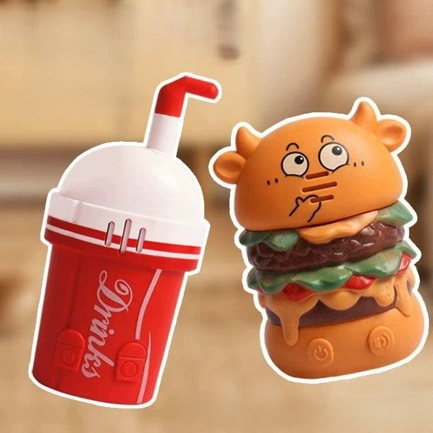 Silly toy resembling a drink cup and a hamburger with a face on a blurred background