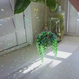 beaded plant suncatcher styled as a cozy gift for plant lovers