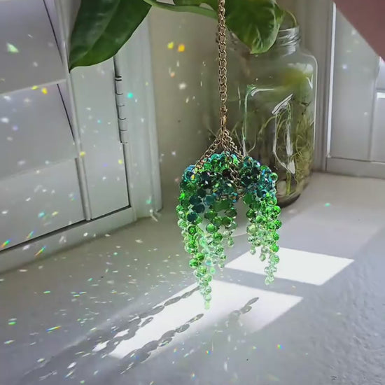 beaded plant suncatcher styled as a cozy gift for plant lovers
