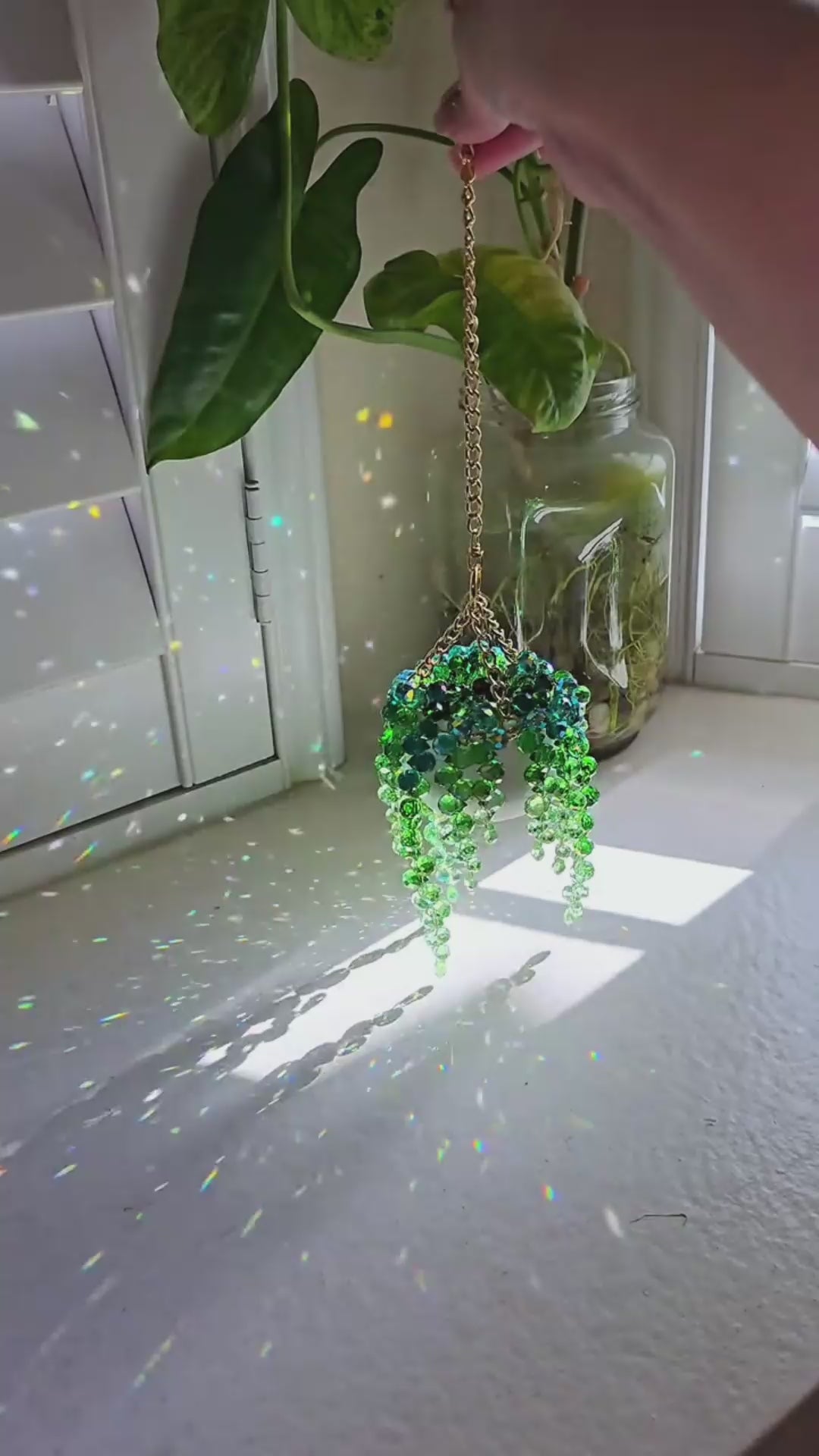beaded plant suncatcher styled as a cozy gift for plant lovers